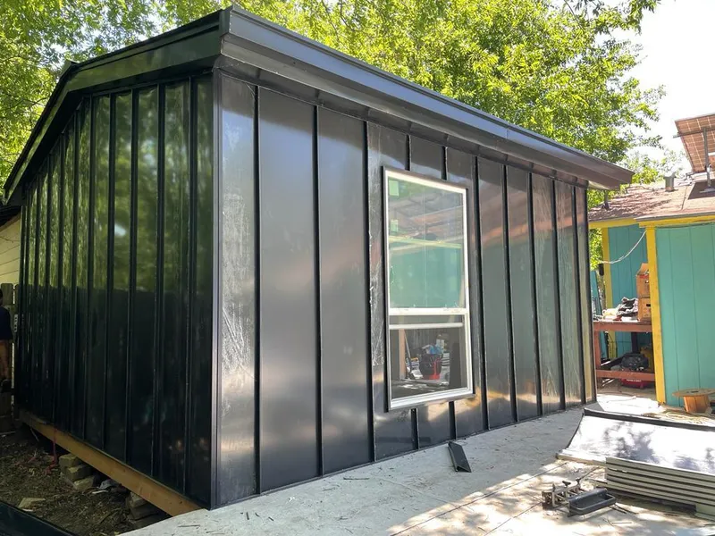 Black standing seam metal wall panels for Roof Inspection in Brockport